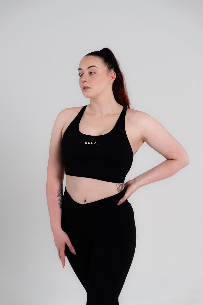 Woman wearing Soha Signature Support Bra in Midnight Black - side angle showing lift and support