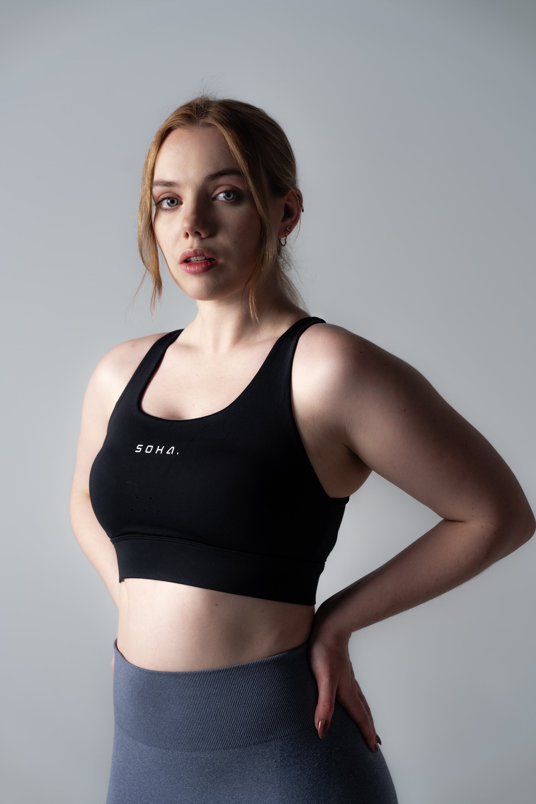 Close-up detail of Soha Signature Support Bra in Midnight Black showing double-layered power mesh fabric